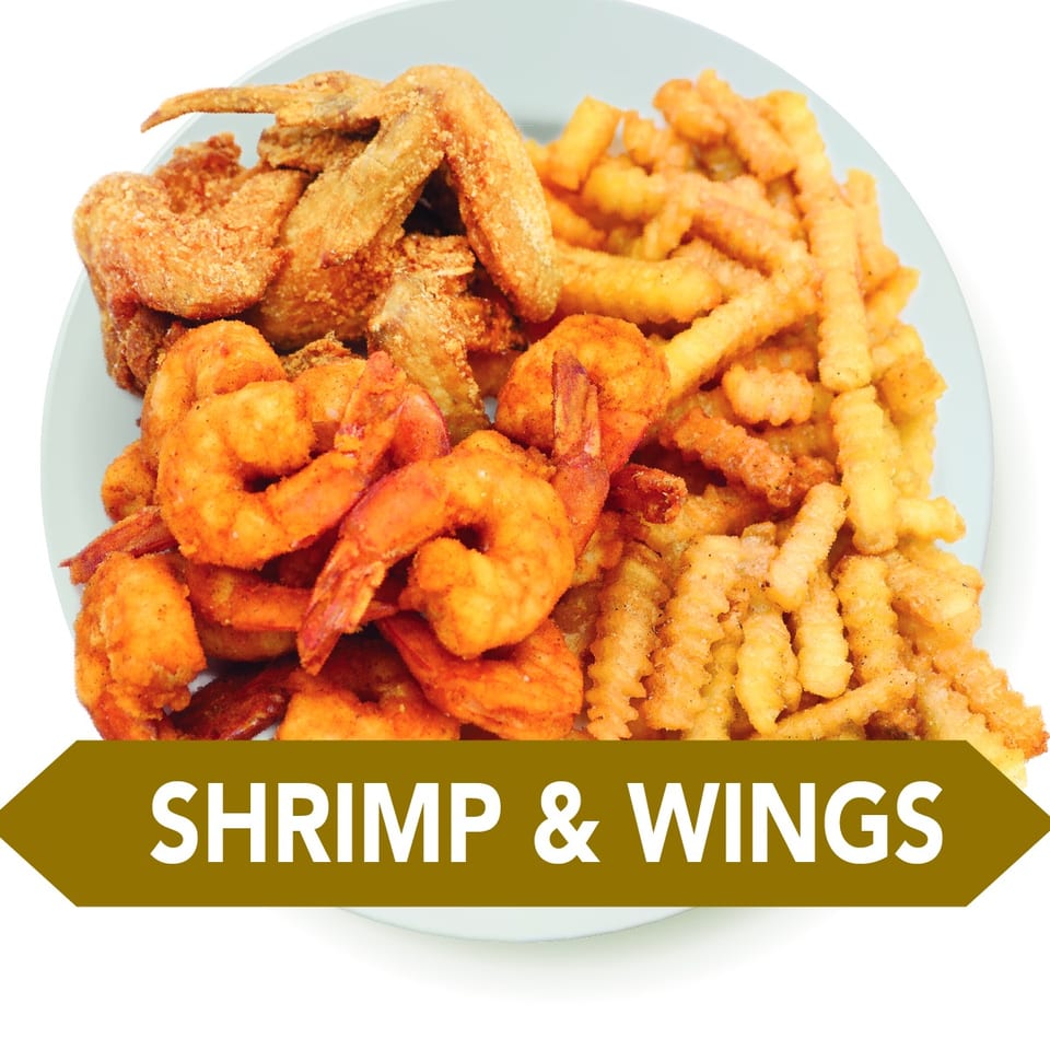 A plate of crispy fried chicken wings, seasoned shrimp, and crinkle-cut french fries.