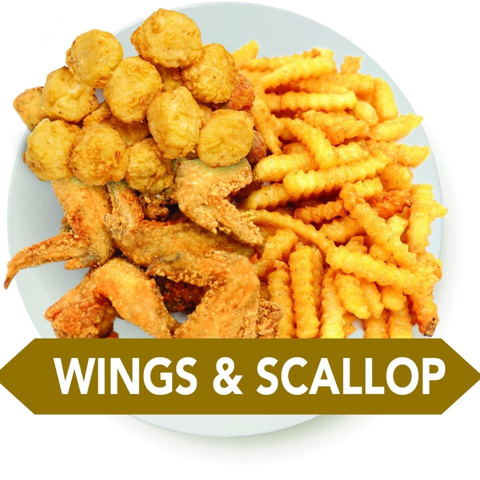 Fried chicken wings, golden scallops, and crinkle-cut fries on a white plate.